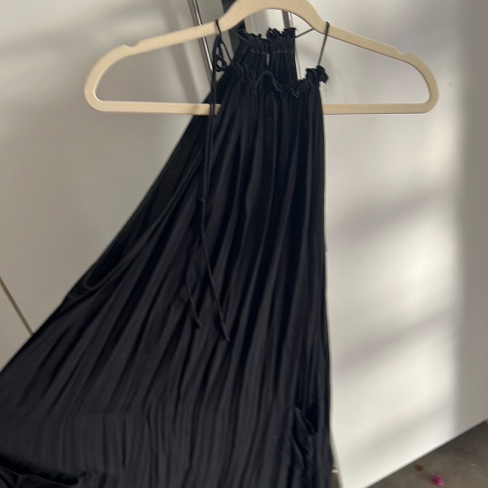 DelacyLos Angeles black tie neck pleated dress with pockets.
